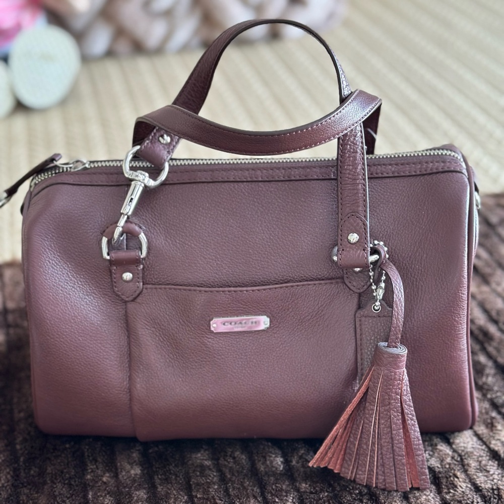 Brand new, with tags, purse by Coach.